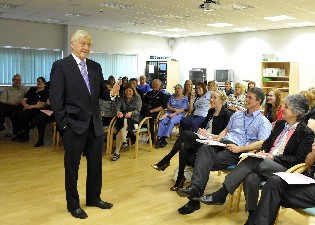 Resized Sir Michael talking to staff at Weston