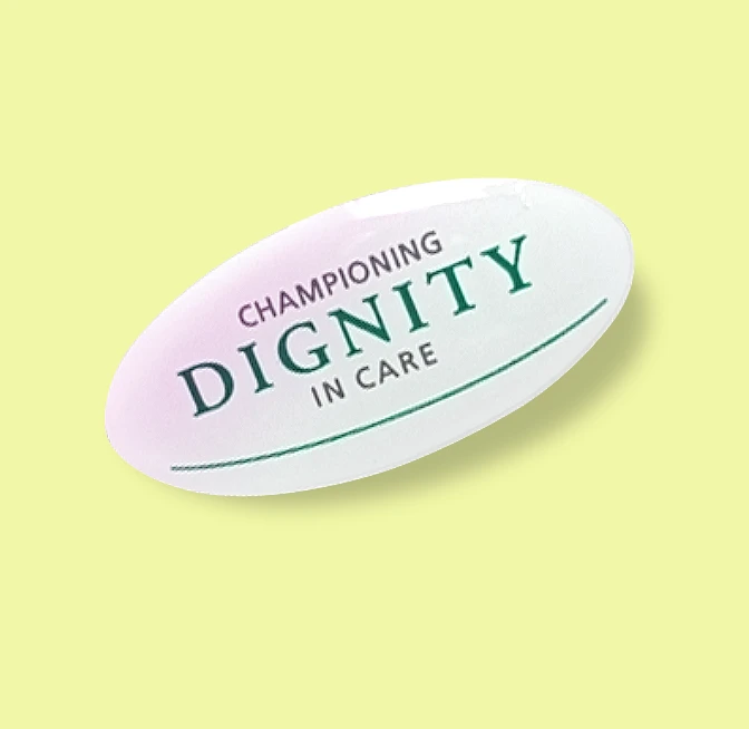 Dignity Champion oval badge